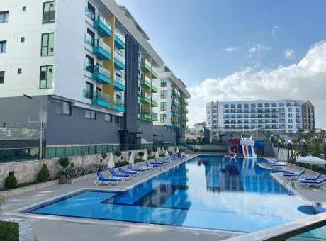 Turecká riviéra, nový moderní apartmán u moře, s bazénem, tenisovým kurtem, skluzavkami, posilovnou, garáží | WaeFoo.com